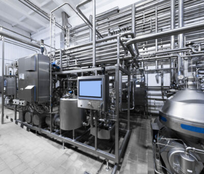 Production chrome background with pipes and wires. Metal pipes close-up. Industrial plant inside view. Rectangular metal pipes . Steel materials, construction supplies