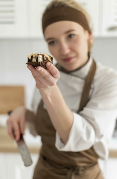 medium-shot-cook-holding-cookie