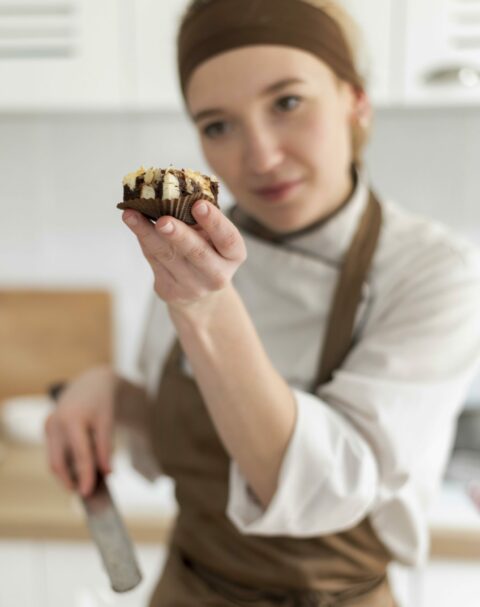 medium-shot-cook-holding-cookie