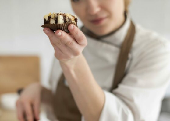 medium-shot-cook-holding-cookie